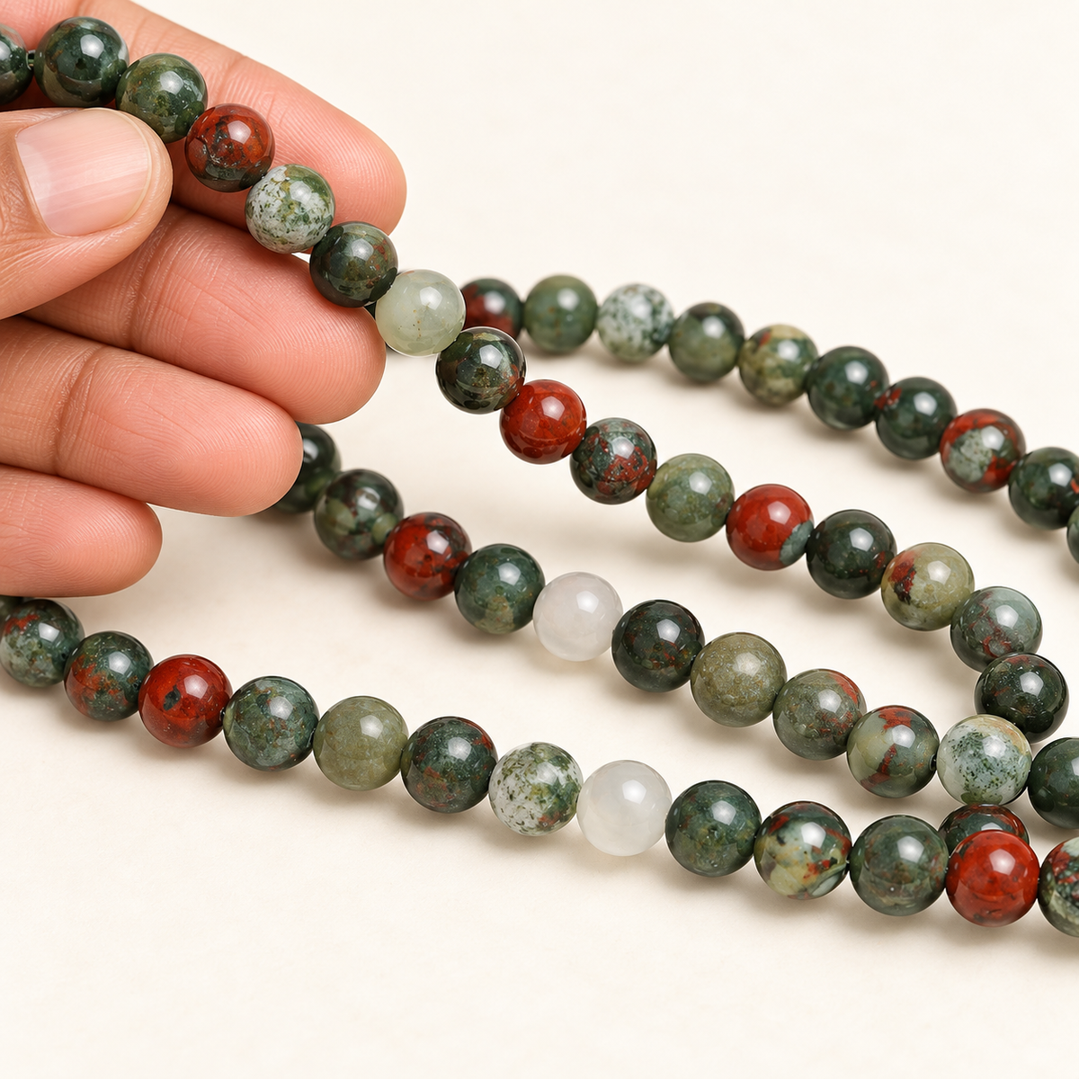 African Bloodstone String — illustrative hand-held styling