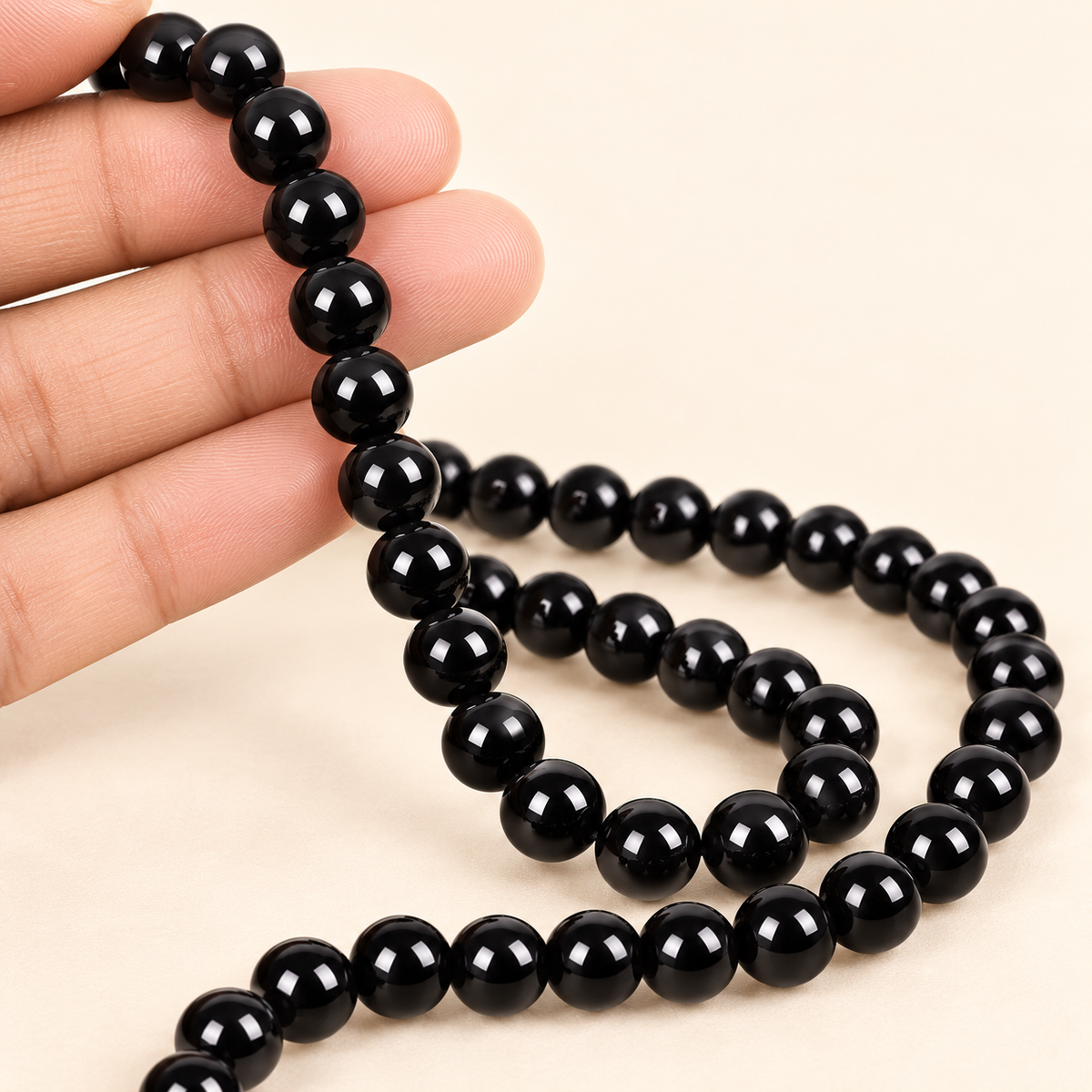 Black Onyx String — illustrative hand-held styling