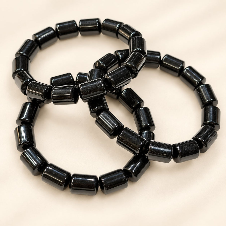 Black Tourmaline Bracelet – Natural Gemstone Jewellery on a warm cream background with a soft faded shadow