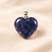blue goldstone heart crystal pendant on ivory with soft shadow