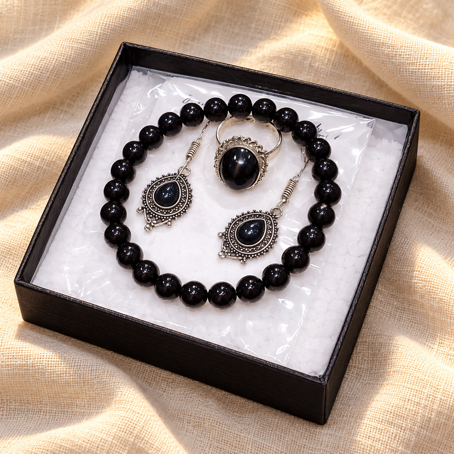 Black Onyx Crystal Jewellery Set – Bracelet, Pendant & Earrings on warm cream linen