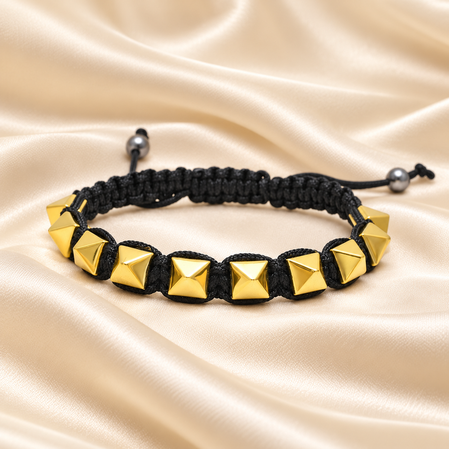 Golden Pyrite Pyramid Bracelet – Coated Hematite Jewellery on champagne fabric