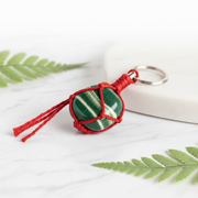 Green Z Crystal Keychain on white marble surface