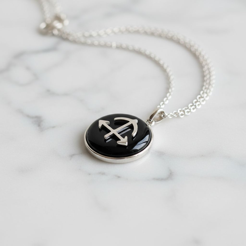 Sagittarius pendant on white marble surface