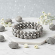 Natural Grey Jasper Bracelet on white marble with grey jasper stones and white flowers