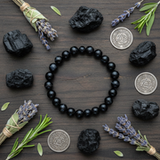 Natural Sulemani Hakik Bracelet flat lay with black crystals and silver coins