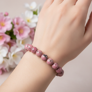 Natural Pink Rhodonite Bracelet worn on wrist