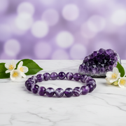 Natural Chevron Amethyst Bracelet on white marble with amethyst cluster