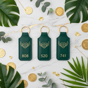 Three Goodhabiitss Divya Kavach Keychains flat lay with gold coins