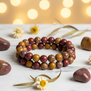 Natural Mookaite Jasper Bracelet on white marble with vibrant mookaite stones and flowers
