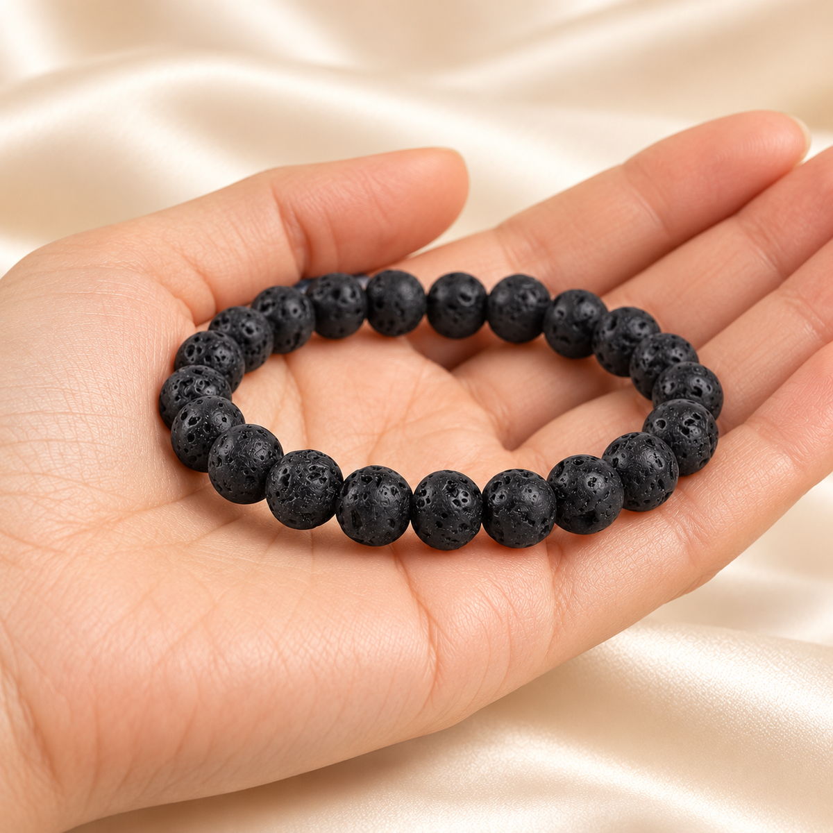 Lava Stone 8mm bracelet — illustrative hand view