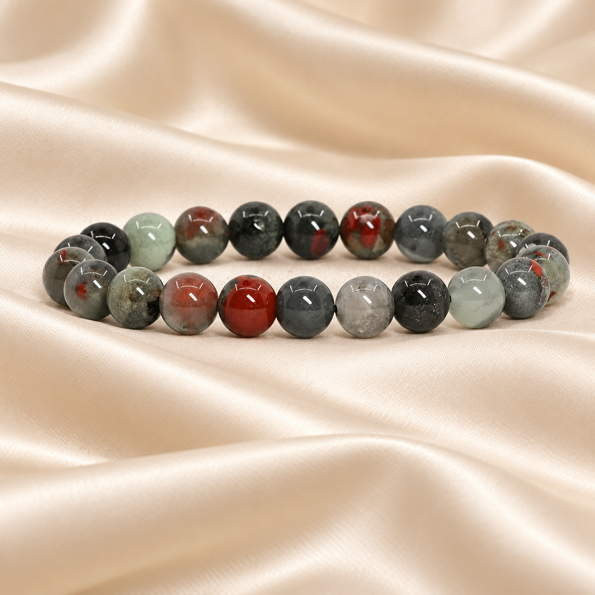 Natural African Bloodstone Bracelet – 8mm Gemstone Jewellery on champagne fabric
