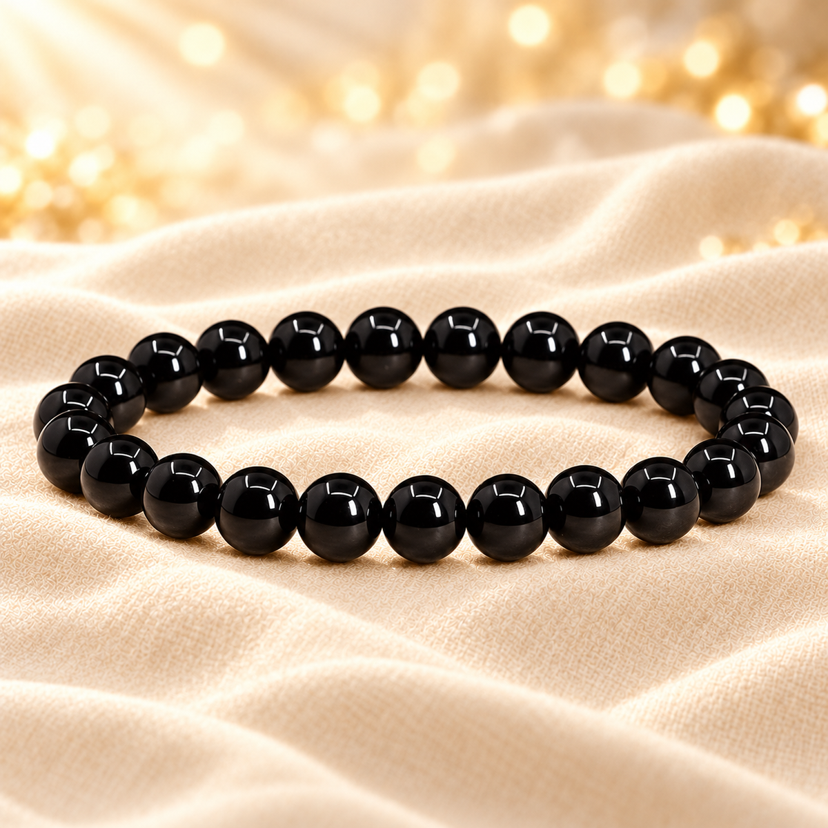 Natural Black Tourmaline Bracelet – Gemstone Jewellery on champagne fabric