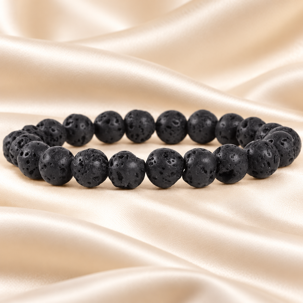 Natural Lava Stone Bracelet – 8mm Gemstone Jewellery on champagne fabric