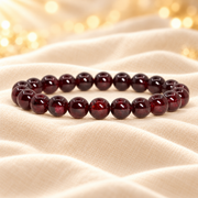 Natural Red Garnet Bracelet – 8mm Gemstone Jewellery on champagne fabric