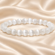 Natural Cat Eye White Selenite Bracelet – 8mm Gemstone Jewellery on champagne fabric