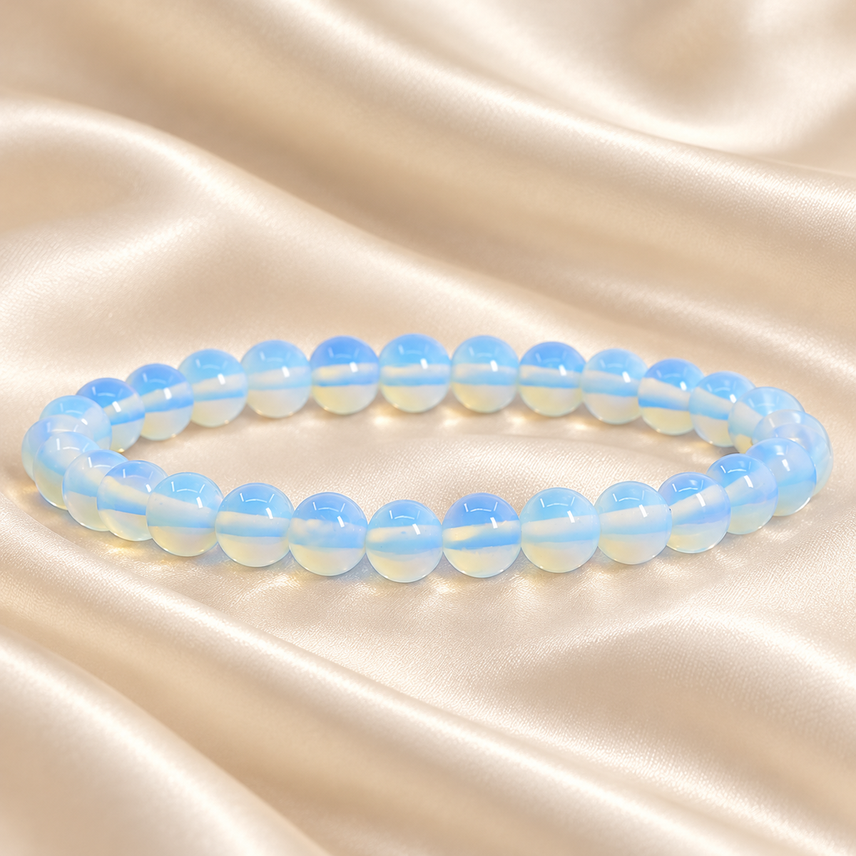 Opalite Bracelet – 8mm Synthetic Bead Jewellery on champagne fabric