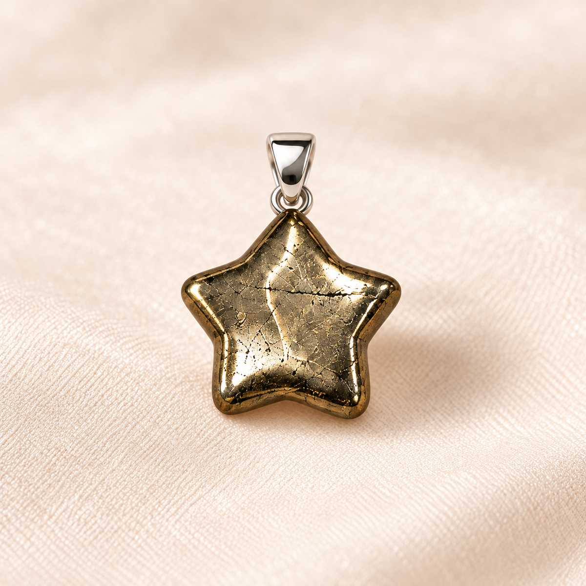 pyrite star pendant on ivory with soft shadow