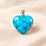 turquoise heart pendant on ivory with soft shadow